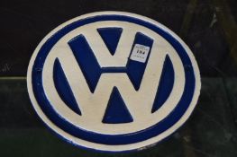 A cast iron sign VW.