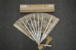 A Brussels lace fan with original box.