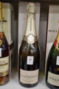 A bottle of Louis Roederer Champagne, boxed.