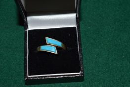 A decorative silver ring.