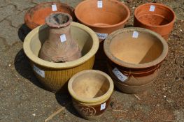 A group of plant pots etc.