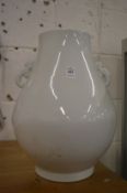 A large Chinese blanc de chine twin handled vase.
