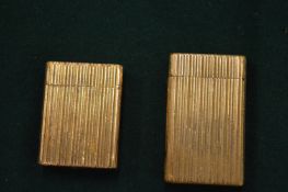 Two Dupont cigarette lighters.