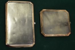 Two silver and gold inlaid cigarette cases.