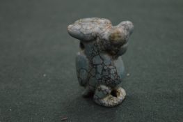 Carved hard stone animal.