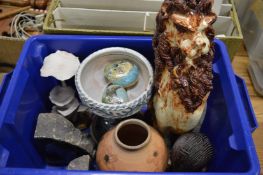 Pottery model of a lion and other decorative items.