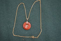 Chinese carnelian pendant with gold chain.