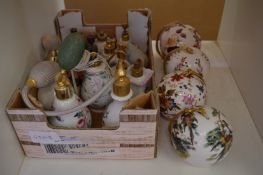A collection of porcelain perfume atomisers and four pomanders..