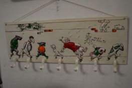 A novelty cast iron coat hook.