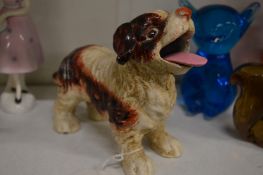 A novelty cast iron dog with articulated tongue.