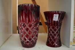 Two ruby tinted glass vases.