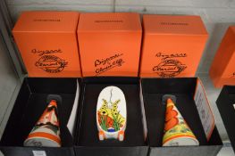 Two Wedgewood Clarice Cliff collection Bizarre conical shaped sugar shakers, boxed and another sugar