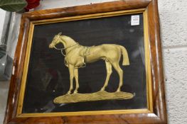 An ormolu relief cast model of a horse, framed and glazed.