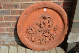 A good large circular classical style terracotta plaque.