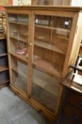 A pine two door bookcase.