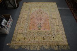 A part silk Persian prayer rug, pink ground with floral decoration, 188cm x 139cm.
