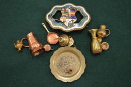 An enamel brooch and other items.