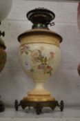 A blush ivory and floral decorated porcelain oil lamp base.
