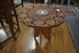 An Eastern hardwood occasional table.