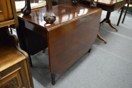 A mahogany drop-leaf dining table.