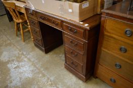 A mahogany twin pedestal desk.