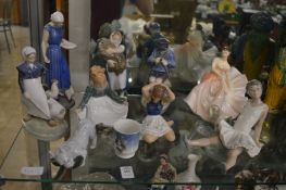 A group of Royal Copenhagen figures, a small beaker together with a Nao ballerina and a Royal
