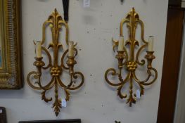 A pair of gilt metal twin branch wall appliques together with a matching smaller single light wall