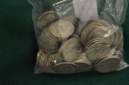 A large quantity of pre-decimal shillings.