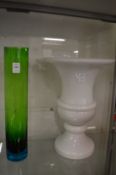 A stylish mid century green and blue tinted cylindrical vase together with a large white glass urn