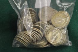 A large quantity of pre-decimal shillings.