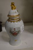 A small Chinese armorial vase and cover.