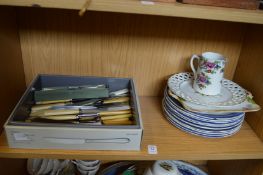 Decorative china and cutlery.