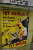 A novelty printed metal sign 'My Garage My Rules'.