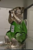A squirrel shaped green glass and silver plated claret jug.