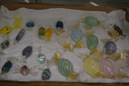 Quantity of novelty colourful glass models of sweets.