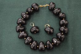 A Kenneth Lane black stone vintage necklace and earrings.