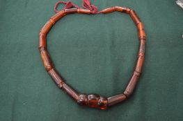 A chunky amber bead necklace.