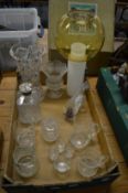 Cut glass vases, engraved glass tankard, stylish light fitting and other glassware.