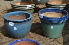 Two large glazed plant pots.