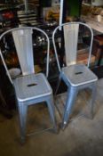 A pair of metal bar stools.