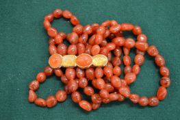 A chunky carnelian bracelet.