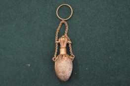 An egg shaped pendant perfume bottle.