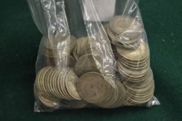 A large quantity of pre-decimal shillings.