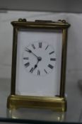 A brass carriage clock.