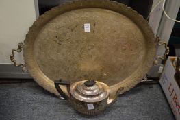 An engraved silver plated twin handled tray and a plated teapot.