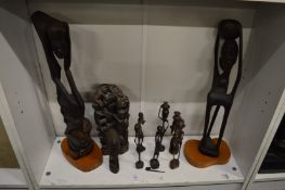 A group of African carved wood figures.