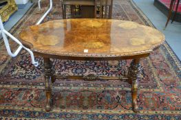 A good Victorian figured walnut low stretcher table.