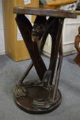 Carved African hardwood stool modelled as a crouching man.