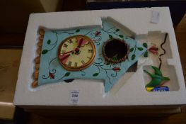 A decorative wall clock, three Oriental pictures and two decorative mirrors.