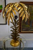 A pair of gilt metal palm tree table lamps.
